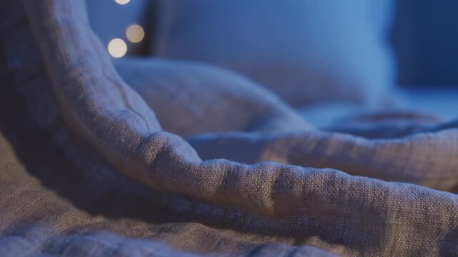 Soft fabric folds with gentle lighting and bokeh, creating a cozy and serene atmosphere, ideal for relaxation and home decor concepts