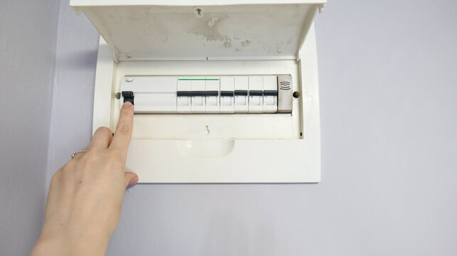 Open electrical circuit breaker panel in an apartment interior. Close-up of home electrical distribution box used for power control and safety management