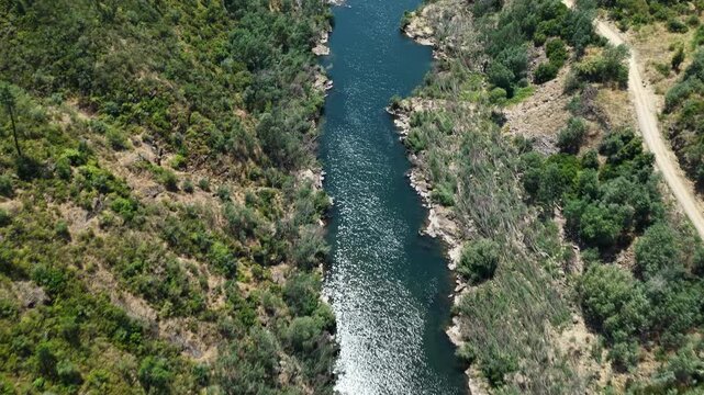Cinematic drone flight over river and natural landscape in the Castelo do Bode region in Portugal.
4K high quality panoramic aerial footage