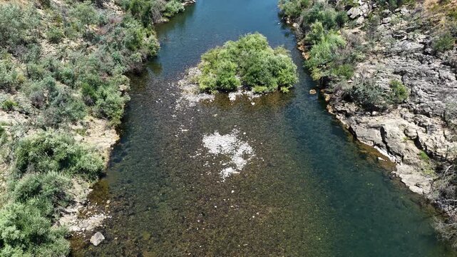 Aerial landscape of Castelo do Bode Dam in Portugal with river and riverside vegetation.
4K high quality cinematic footage.
