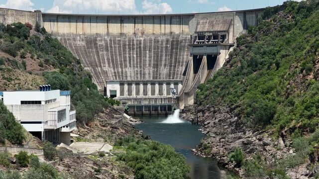 Aerial view of Castelo do Bode Dam in Portugal with river and surrounding natural landscape.
4K high quality cinematic footage.