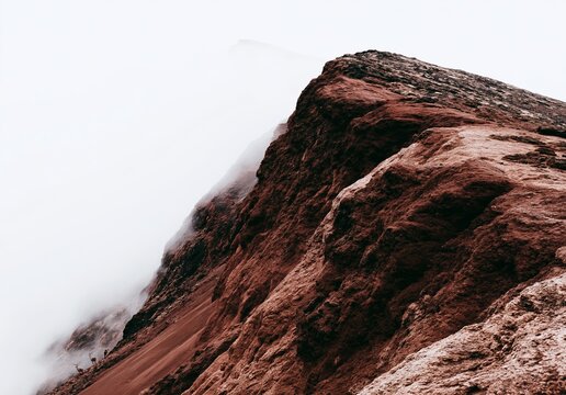 Amateur photo: atmospheric landscape about essence of solitude and reflection. The scene balances the weight of misty, rolling hills against a piercing sunburst through the clouds, evoking a deep emot