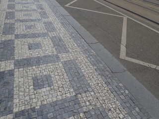 Fototapeta premium cobble tiles pattern on a street in city