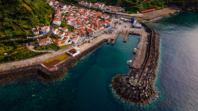 Aerial high angle view of Ribeira Quente fishing harbor and breakwater pier
