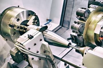 CNC Lathe Machining Artillery Shell Body in Defense Manufacturing © Sergey Ryzhov