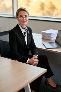 Businesswoman in suit and glasses