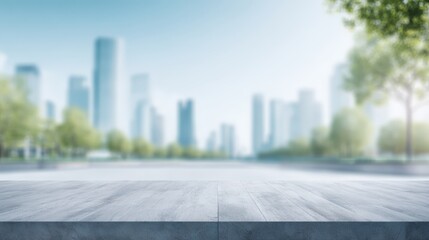 Fototapeta premium Blurred cityscape background with modern skyscrapers and green trees, featuring a concrete platform in the foreground, ideal for presentations or product displays in an urban environment