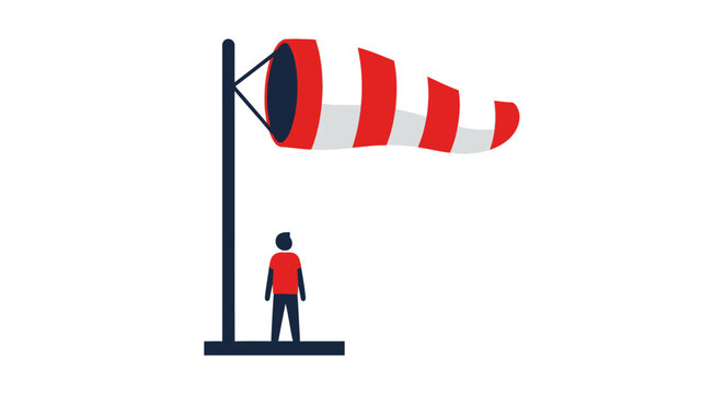 Person standing beside colorful windsock illustration.