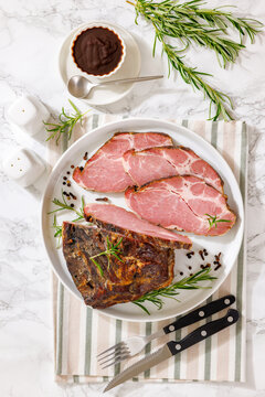 Smoked and baked pork collar on a plate