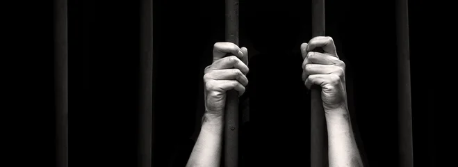 Sad young girl in prison © Marina