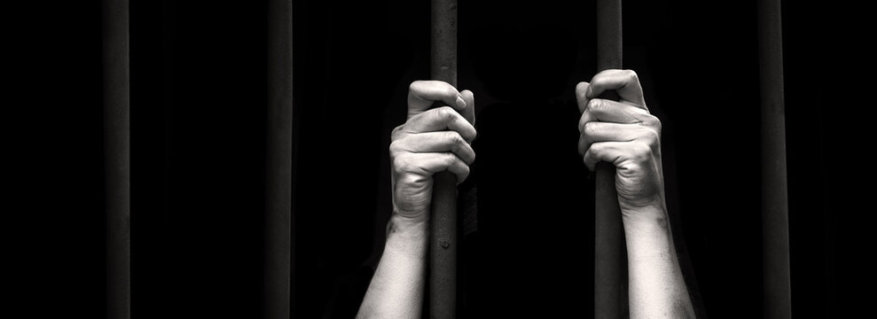 Sad young girl in prison