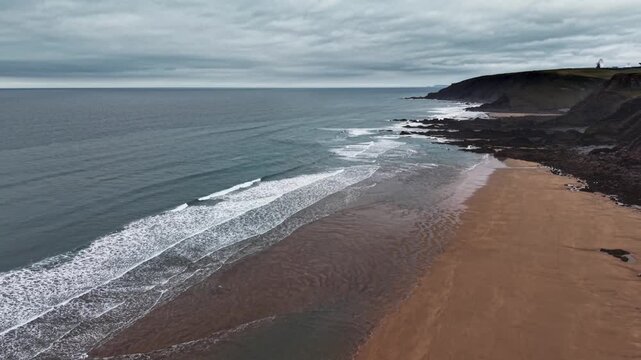 Gloomy cloudy day aerial view looking Northwards on Sandymouth Bay Cornwall