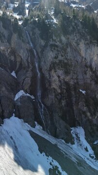 Simme river source glacier water melting Sibe Br&uuml;nne Switzerland deep forest, vertical video reel