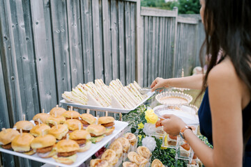 Obraz premium Outdoor Buffet Party with Sandwiches and Sliders in Toronto Backyard
