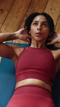 Woman, sit ups and fitness class on laptop in house, health and physical activity for core strength. Above, home and person with tech for workout tutorial, crunches and training for abdomen muscles