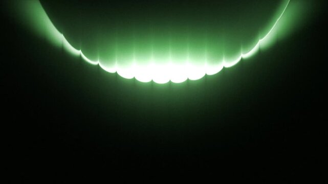 Glowing green crescent light arcs across a dark void in this abstract digital motion video footage