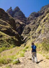 Fototapeta premium Views along the scenic hiking trail ascending from San Pedro,descending from the high threshing ground Era de Berbique toward the coastal village of Puerto de las Nieves in northwest Gran Canaria, Can