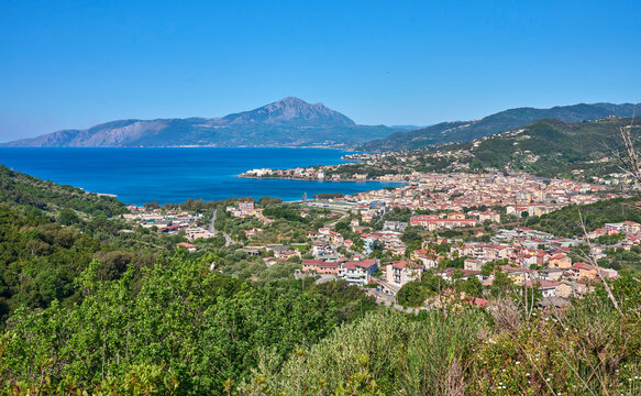 Panoramic coastal view of the seaside town of Sapri with turquoise water, mountains, and Mediterranean landscape under a clear blue sky. Sapri, Campania, Italy