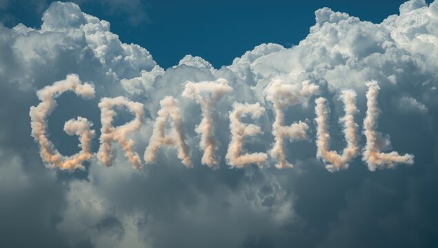 Clouds forming the word Grateful in a blue sky