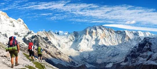 Mount Annapurna south base camp with three tourists © Daniel Prudek