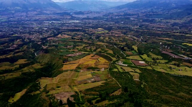 Drone View of Andean Farmland and Mountain Valley in Ecuador, Patchwork Fields, Rural Landscape, Hills and Scenic Highland Travel Background
