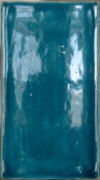 Vertical turquoise glossy ceramic tile background texture