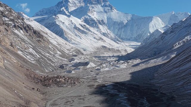 Tilt up drone reveal of Mount Everest North Face from Everest Base Camp, Tibet, China
