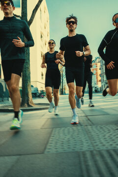 Group running brings people together on a city street for urban training