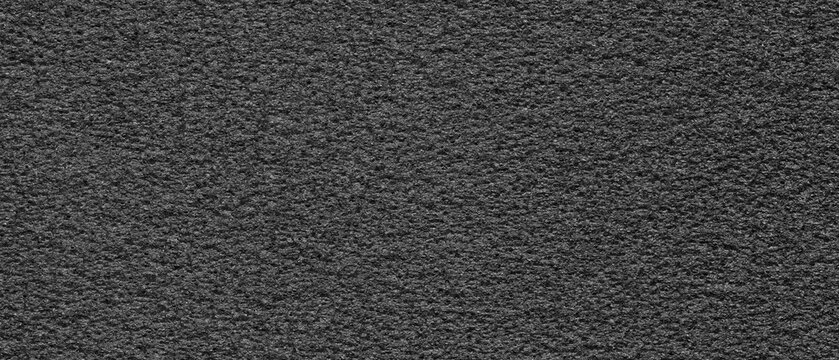 Ultrawide dark foam texture with rough porous surface, subtle grain, natural imperfections, and industrial material pattern.
