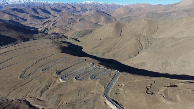 Drone reveal of Mount Everest from the famous 108 switchbacks at Gawula Pass, Tibet, China