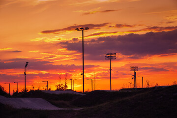 Naklejka premium Sunset at the BMX track (bicycle motocross racing track) at Lee Valley VeloPark in Stratford, East London, UK, with a moody sky