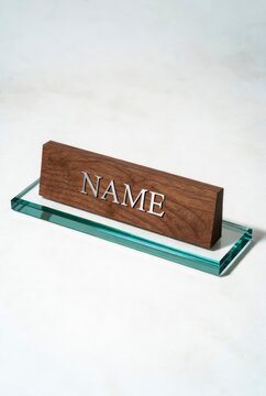 Wooden name plate on glass.