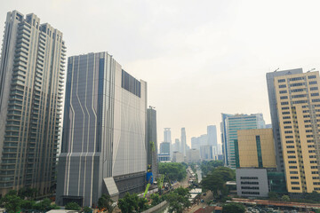 Obraz premium Modern Architectural Towers And Commercial Highrise Buildings Dominate The Cityscape