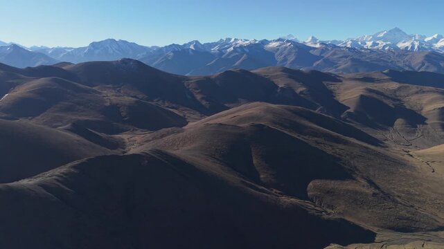Wide-angle drone pan across Mount Everest and the Himalayan range from Gawula Pass, Tibet, China