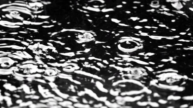 Intense raindrops on a water surface texture