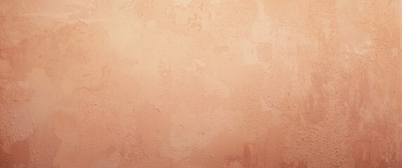 Fototapeta premium Selective focus on textured grunge wall featuring peach fuzz hues and ample copy space