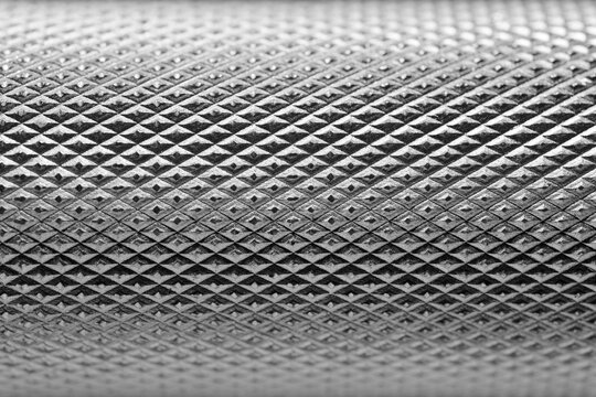 Closeup view of a dumbbell handle in a gym