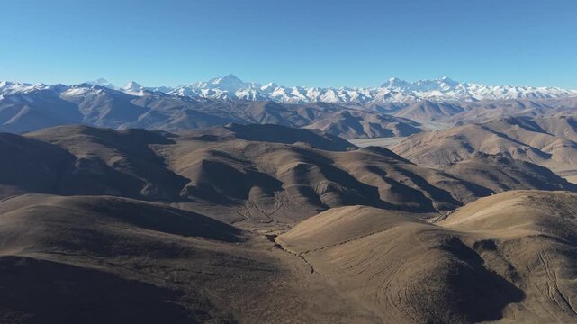 Drone flight toward Mount Everest across the Tibetan Plateau from Gawula Pass, Tibet, China