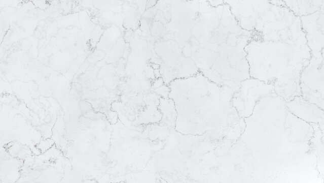 A close-up view of white marble with gray veining, showing its natural texture and patterns.