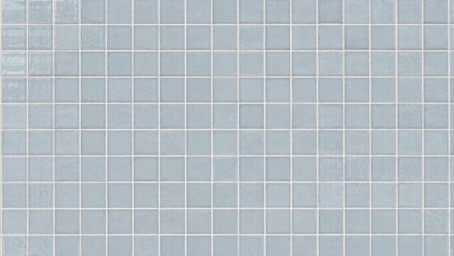Light blue square ceramic wall tiles with white grout forming a uniform grid pattern