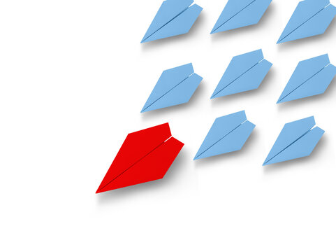 Red paper airplane leading formation of blue paper airplanes across white background