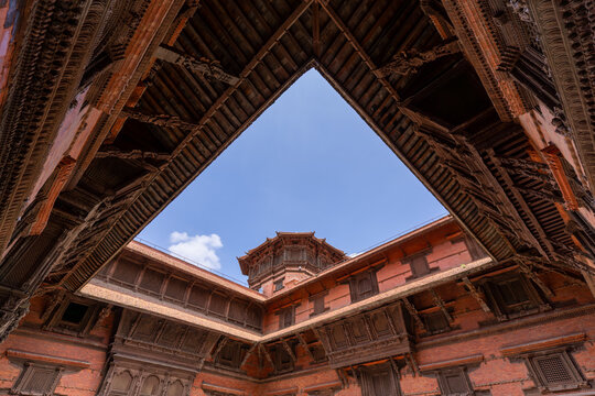 Ancient brick courtyards and carved wooden architecture inside Hanuman Dhoka Durbar Square in Kathmandu, Nepal