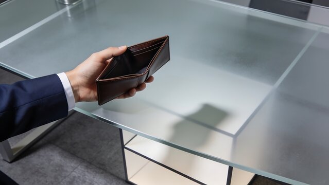 Empty Leather Wallet Held by Businessman in Office