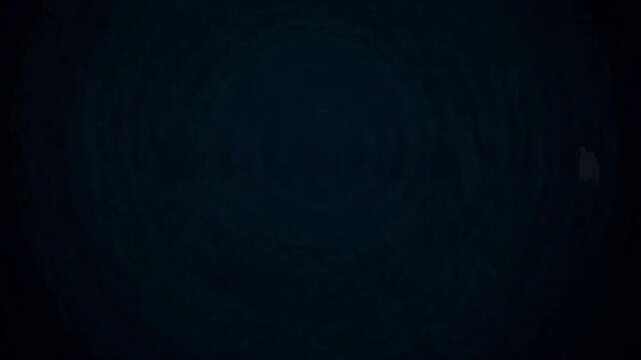 Dark abstract background with subtle circular texture and a hint of deep blue.