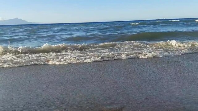 beach sand and lapping waves