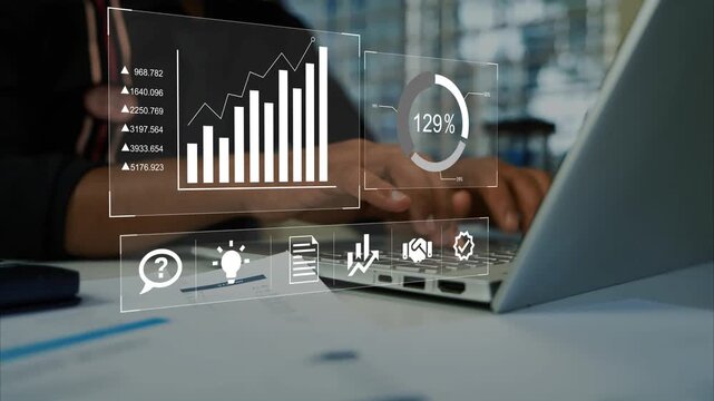 Hands typing on a laptop with holographic floating business charts data icons and a percentage display, Hologram business analytics on laptop screen