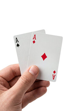 Hand holding two ace playing cards showing winning hand