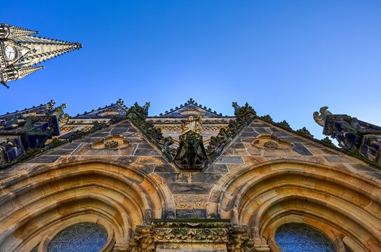 Leipzig, Germany - 25. May 2026: Gothic church facade with gargoyles and spire reaching blue sky