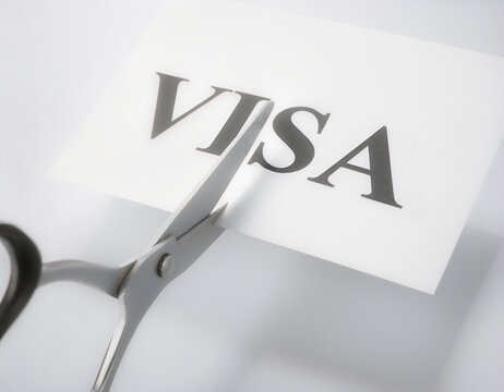 Scissors Cutting Visa Text as Reduced Immigration Quota Concept