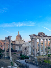 Naklejka premium Vertical shot of Ancient Roman Forum ruins with Temple of Saturn and Septimius Severus Arch